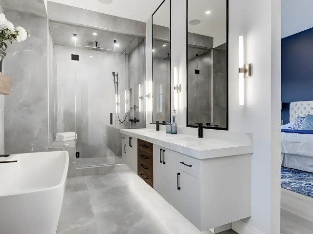 Bathroom with a freestanding tub and a white double vanity