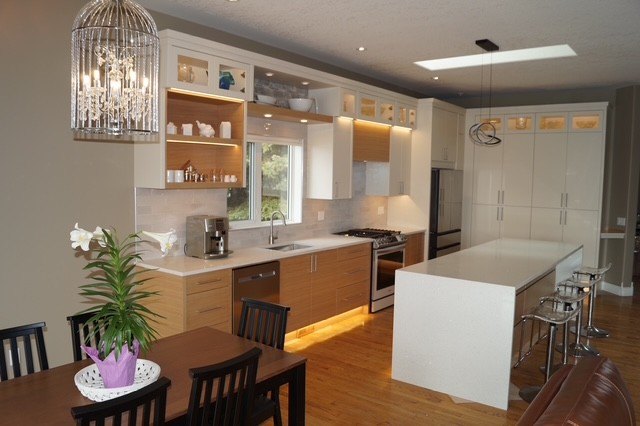 The finished kitchen with a timber island, full-height cabinetry and open display shelving